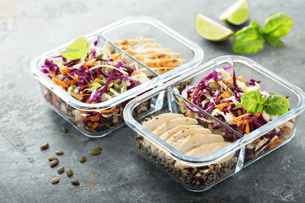 two glass dishes with protein and fermented food prepped for meals
