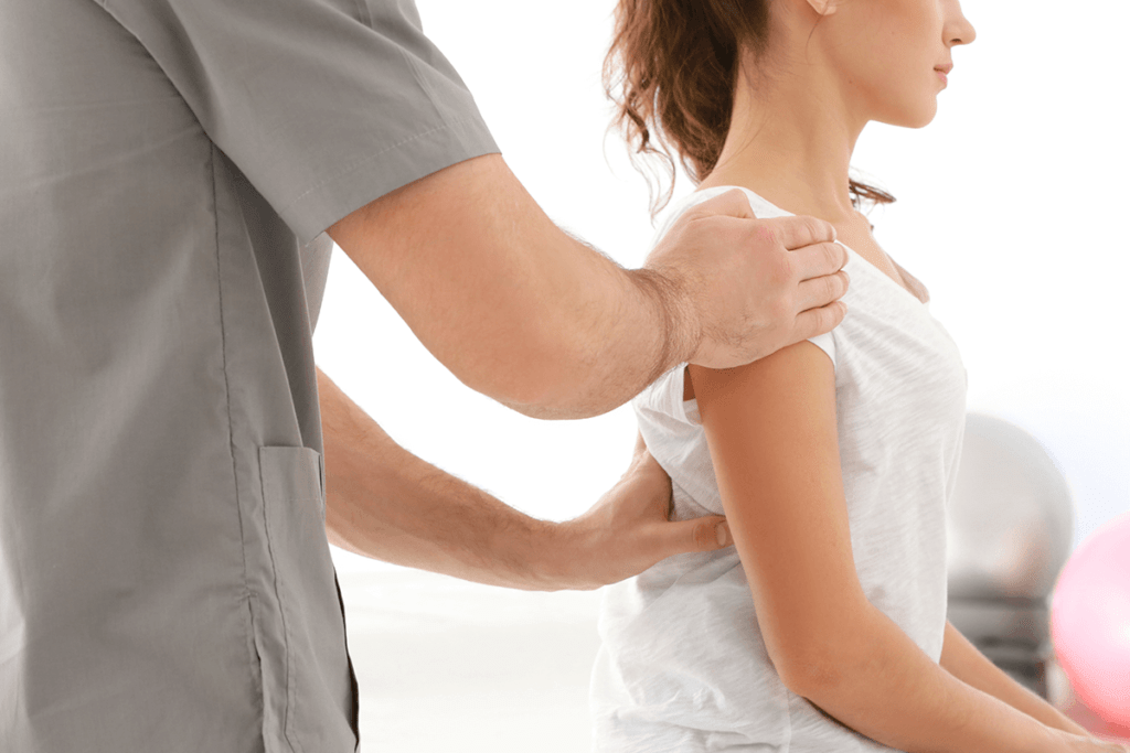 doctor working on woman's back pain