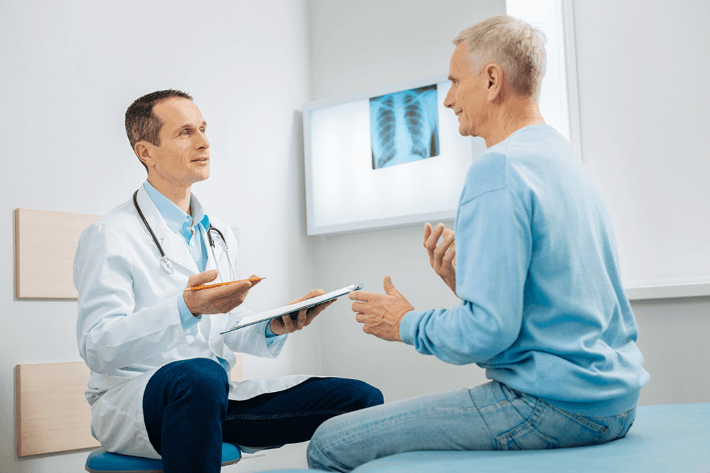 doctor talking to patient in office