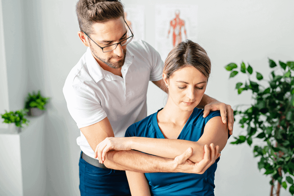 doctor stretching a woman's arm