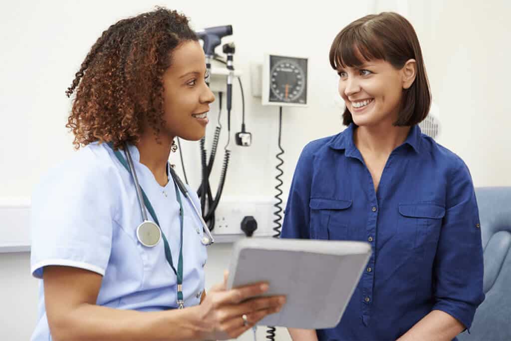 nurse showing a patient a chart