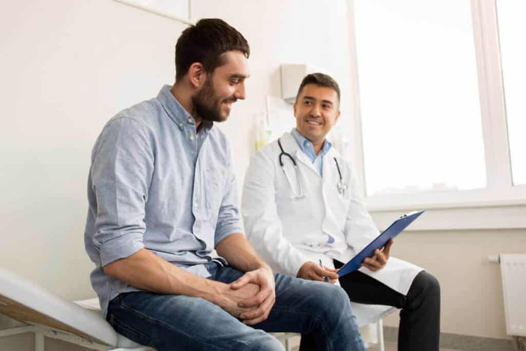 practitioner sitting and talking to their patient