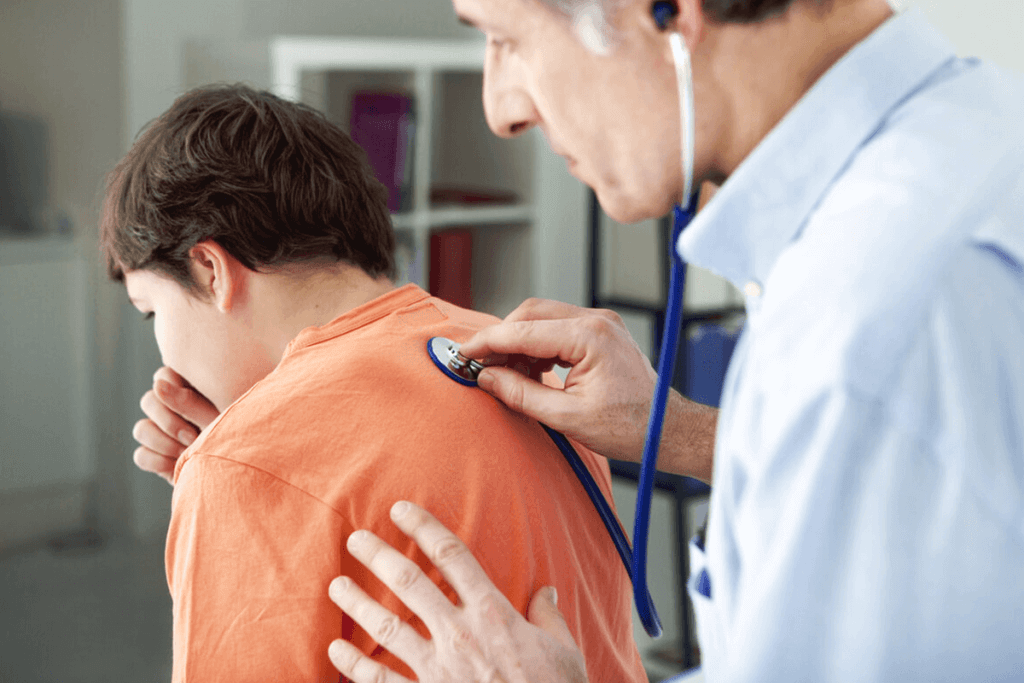 Auscultation of a child’s lungs by a doctor.