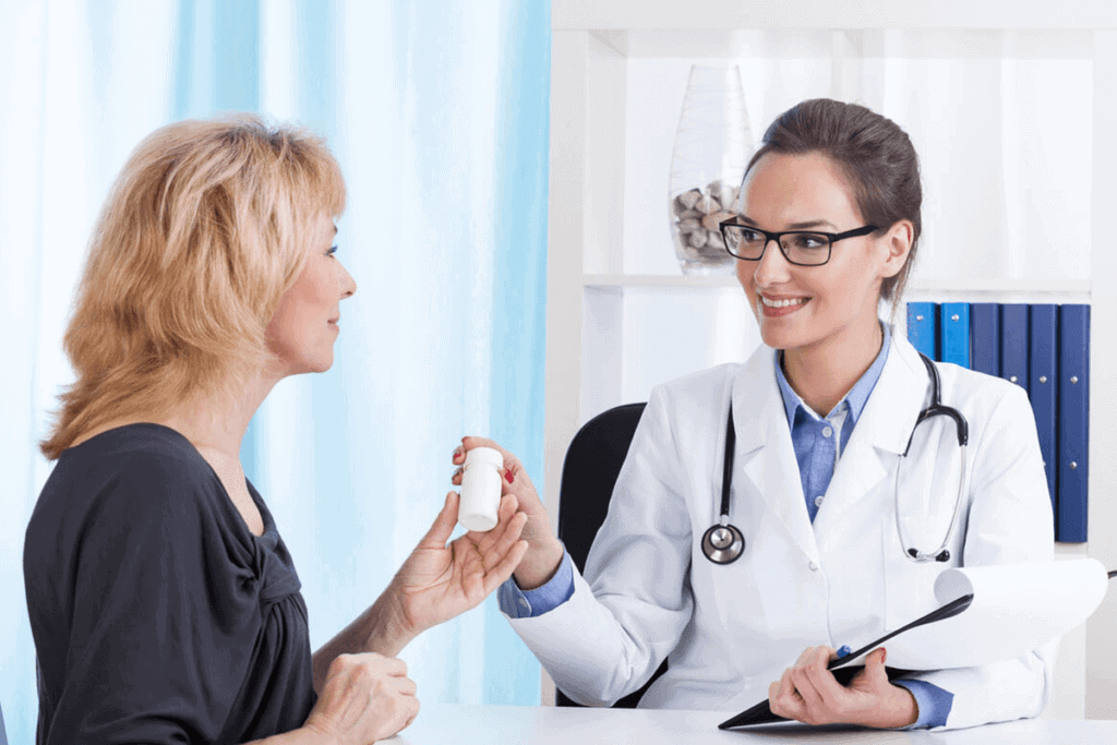 practitioner giving patient pills