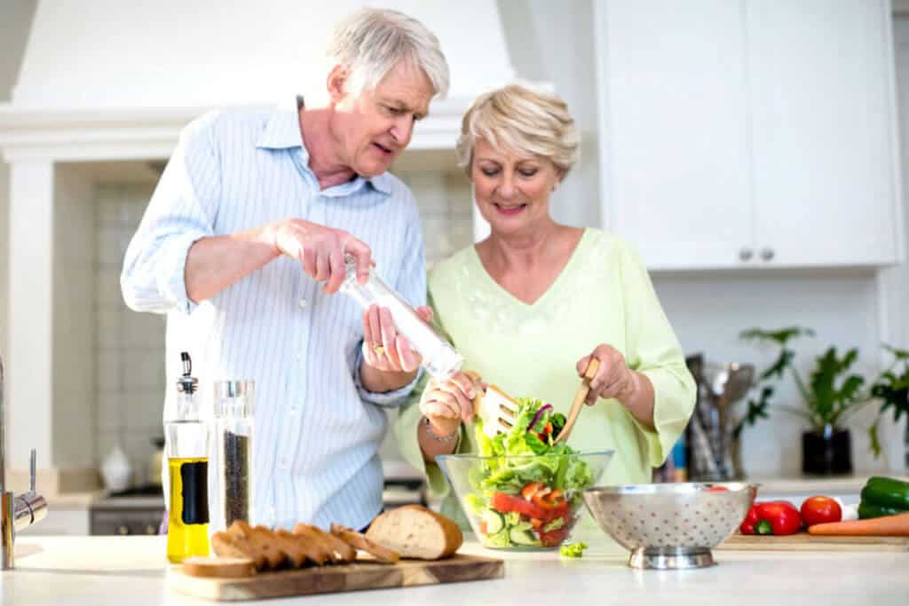 couple making food in kitchen