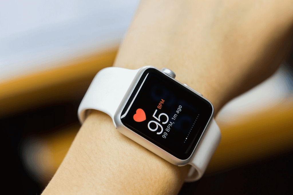 close up of person's arm with apple watch on it showing health app