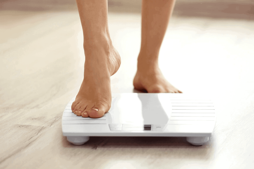 person stepping on a scale