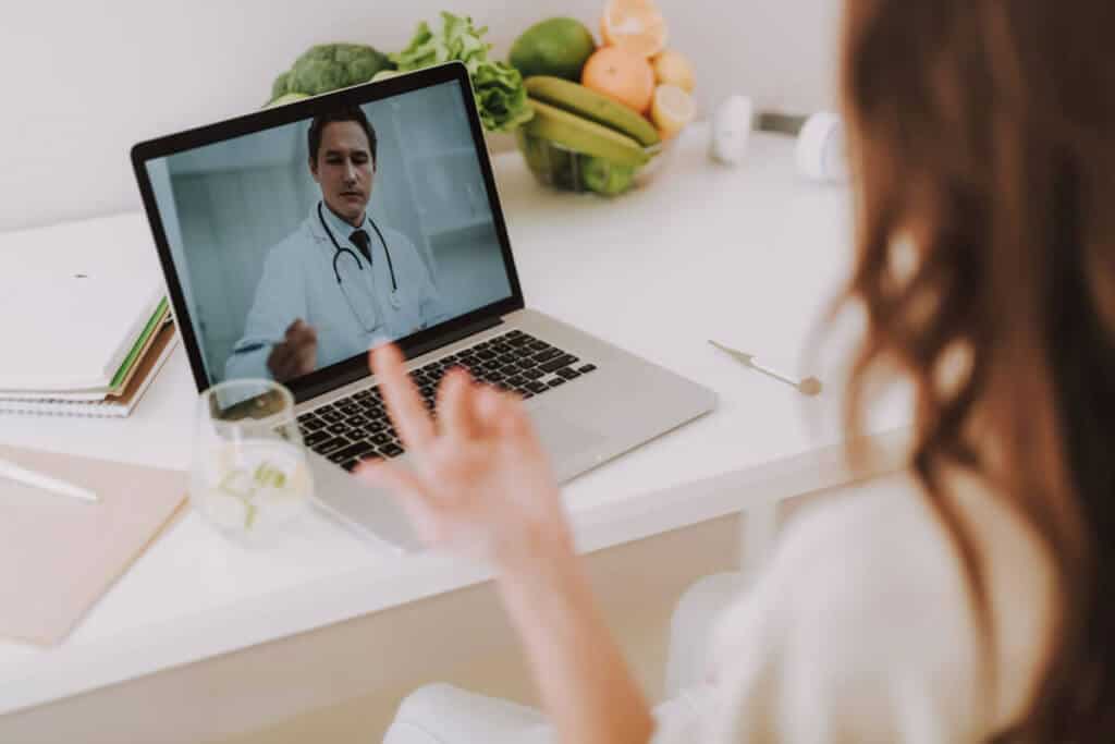 patient on a video chat with doctor from her home