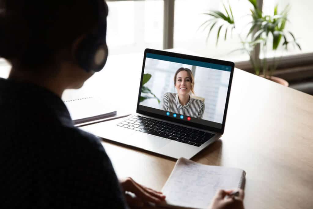 person on laptop chatting with another person on a video call