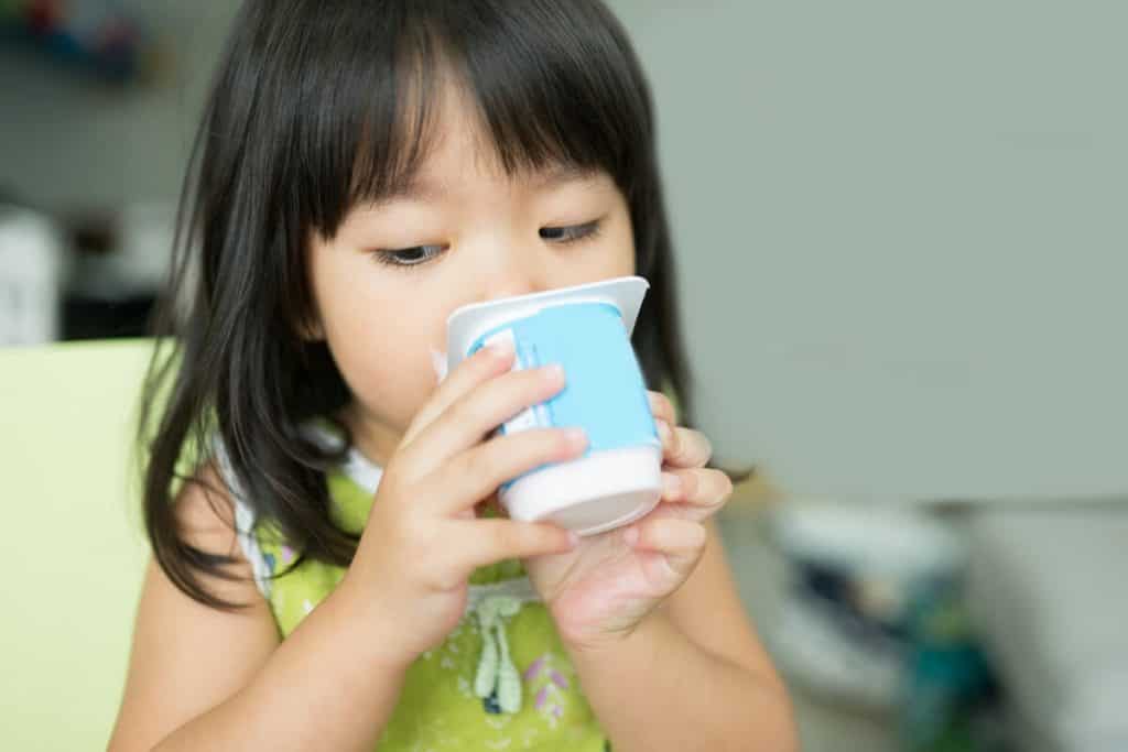 Image of child eating yogurt