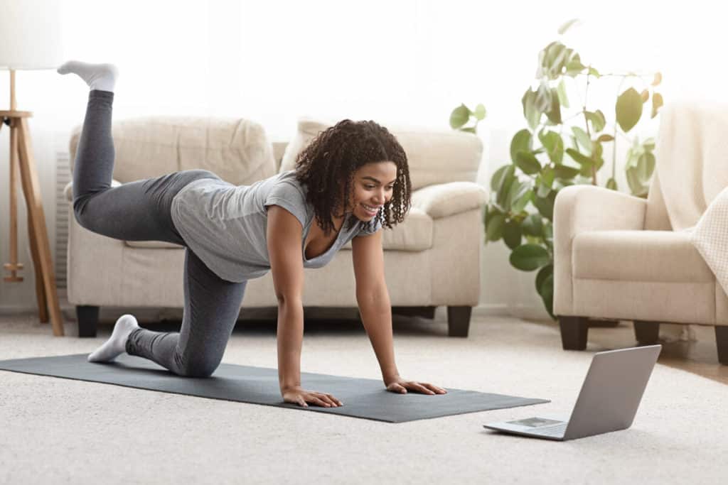 Woman doing virtual yoga