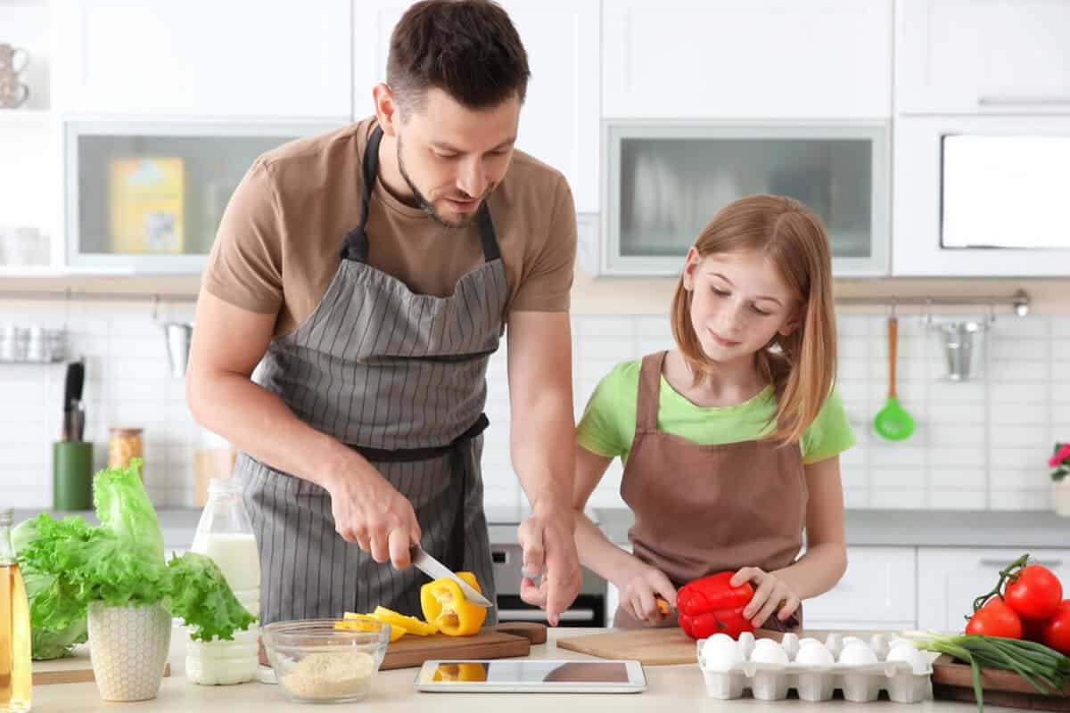 Man cooking with a child
