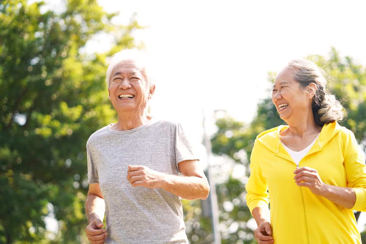Elderly man and woman exercising 