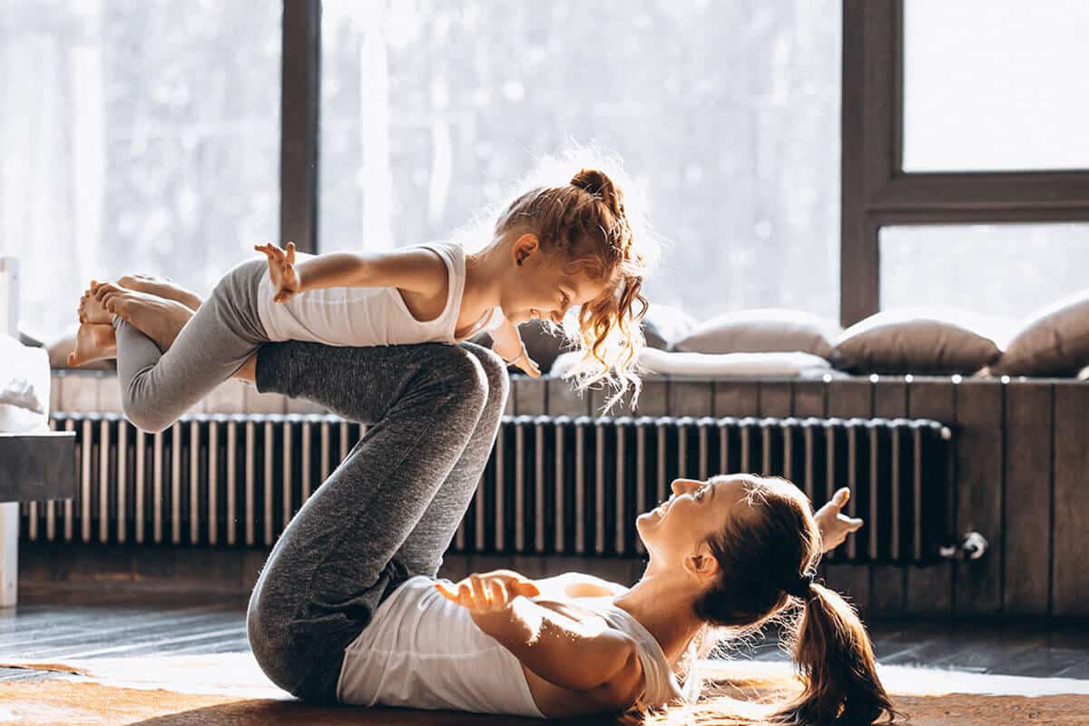 mom and daughter yoga pose