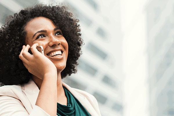 african america woman smiling while talking on the phone