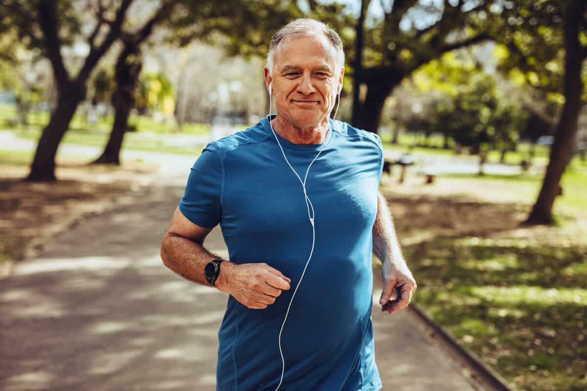 men running outdoors with headphones