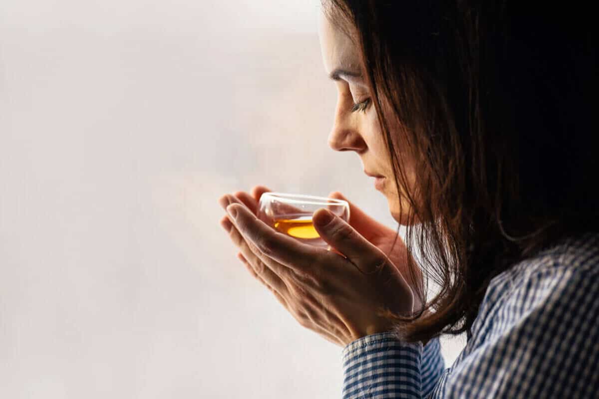 woman smelling her tea