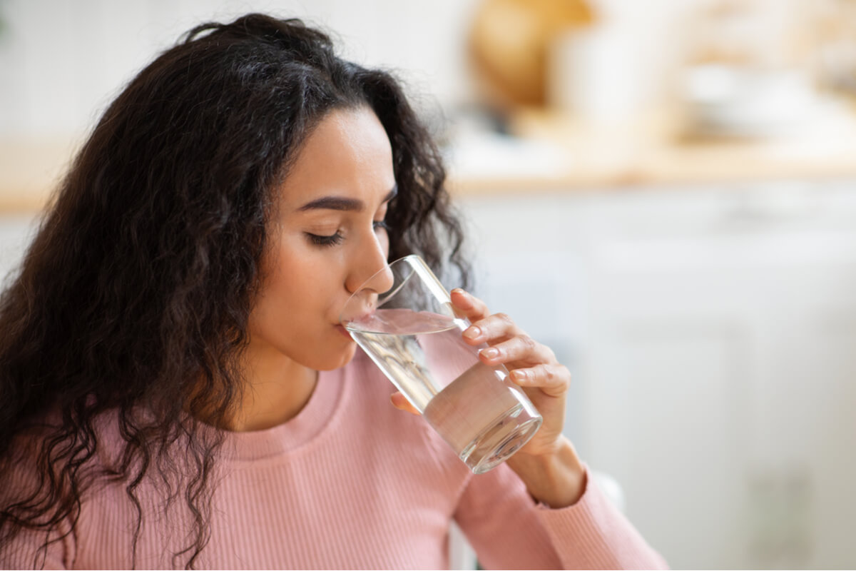 energy boosting foods woman drinking water