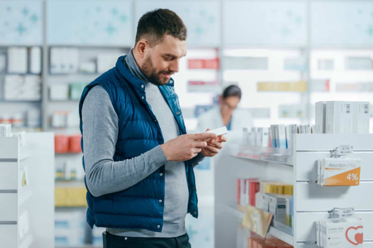 supply chain issues man checking supplement labels