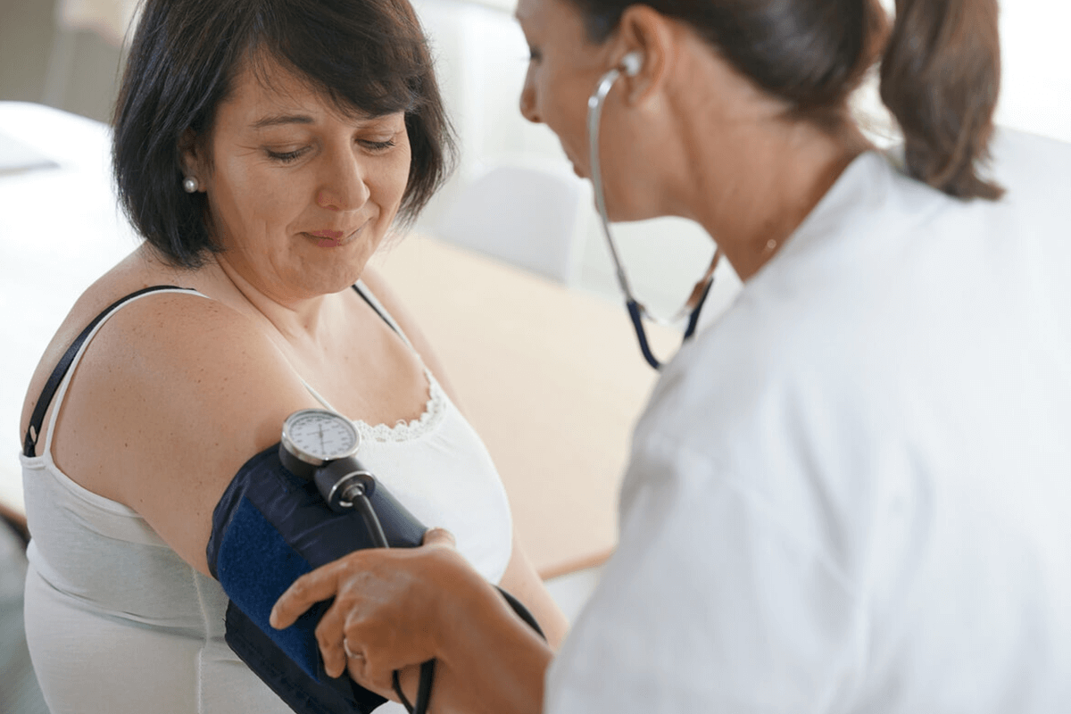 berberine practitioner taking a patients blood pressure