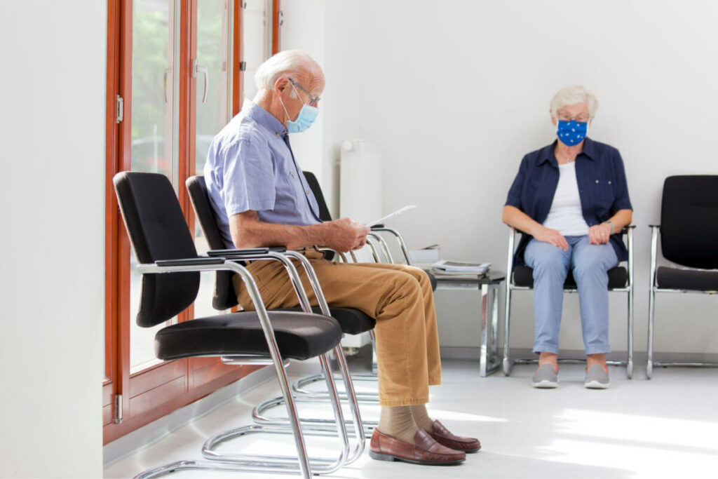 elderly man sitting in a waiting room
