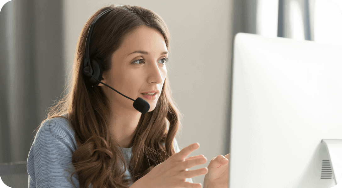 woman with microphone consulting client on phone in customer support service
