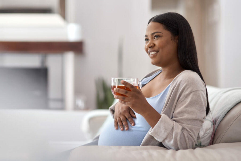 pregnant woman drinking raspberry tea