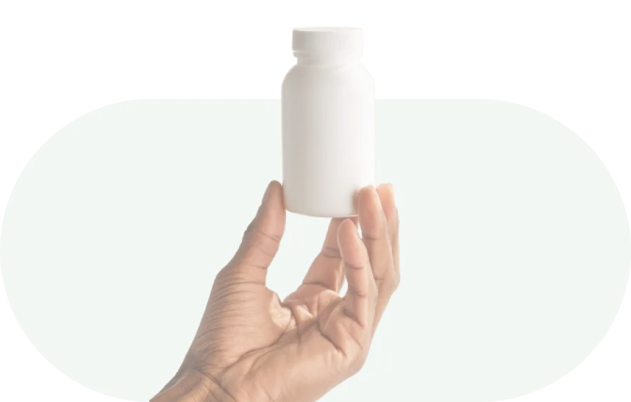 hand holding a pill bottle
